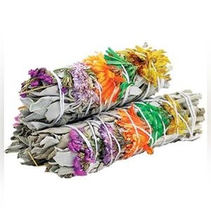 White sage bundles wrapped with organic flowers.